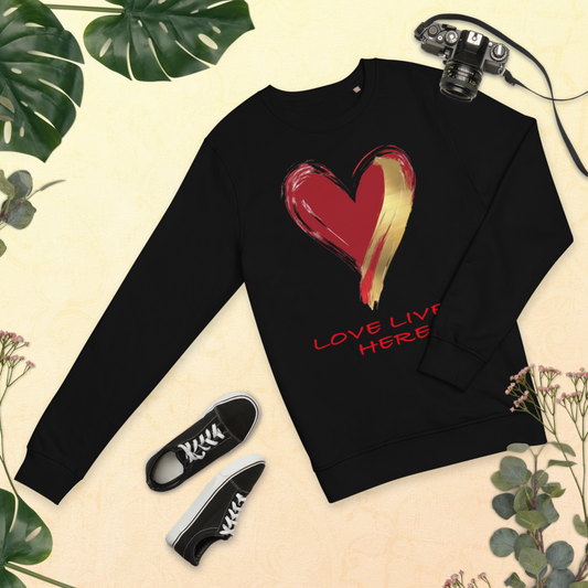 OUR SIGNATURE UNISEX LOVE LIVES HERE™ ORGANIC SWEATSHIRT. BOLD. COZY. MADE WITH HEART